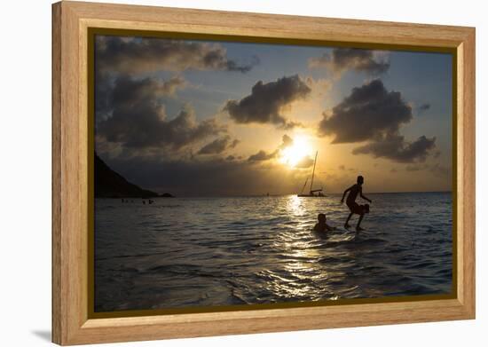 Two Young Boys Attempt to Surf on Praia Da Conceicao Beach at Sunset-Alex Saberi-Framed Premier Image Canvas