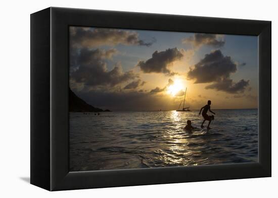Two Young Boys Attempt to Surf on Praia Da Conceicao Beach at Sunset-Alex Saberi-Framed Premier Image Canvas
