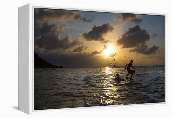 Two Young Boys Attempt to Surf on Praia Da Conceicao Beach at Sunset-Alex Saberi-Framed Premier Image Canvas