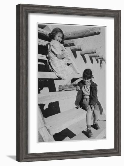 Two Young Girls Sitting On Steps. At San Ildefonso Pueblo New Mexico 1942." 1942-Ansel Adams-Framed Art Print