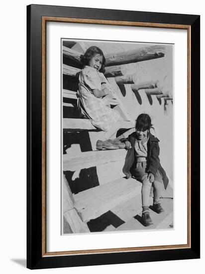 Two Young Girls Sitting On Steps. At San Ildefonso Pueblo New Mexico 1942." 1942-Ansel Adams-Framed Art Print