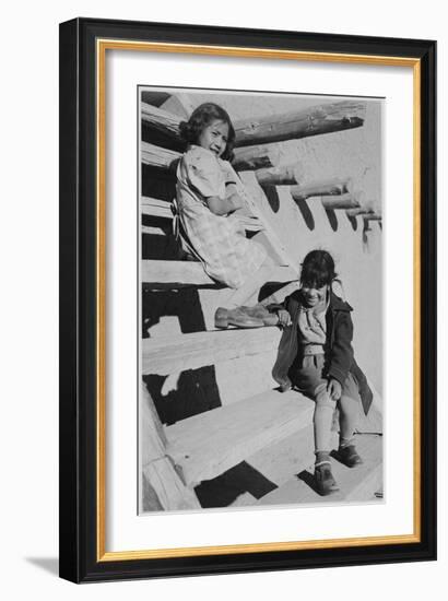 Two Young Girls Sitting On Steps. At San Ildefonso Pueblo New Mexico 1942." 1942-Ansel Adams-Framed Art Print