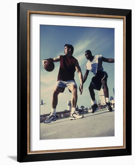 Two Young Men Playing Basketball-null-Framed Photographic Print