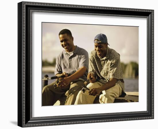 Two Young Men Sitting on The Pier Fishing-null-Framed Photographic Print