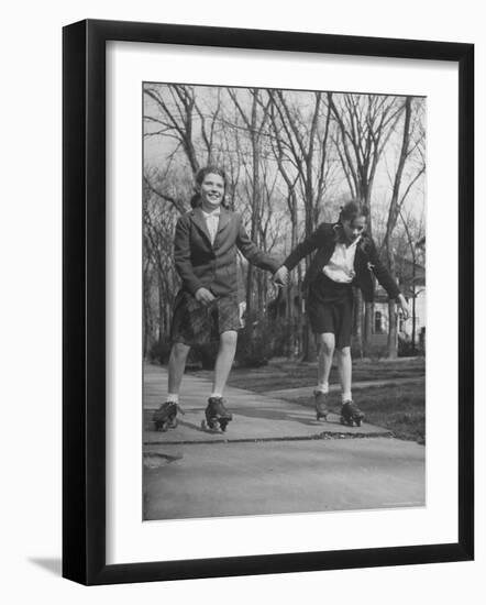 Typical 10 Year Old Girls Known as "Pigtailers" Roller Skating-Frank Scherschel-Framed Photographic Print