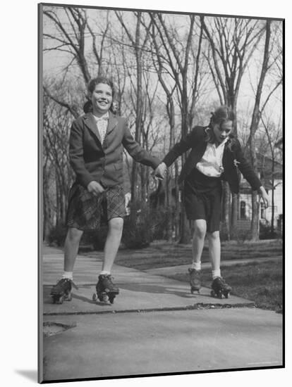 Typical 10 Year Old Girls Known as "Pigtailers" Roller Skating-Frank Scherschel-Mounted Photographic Print