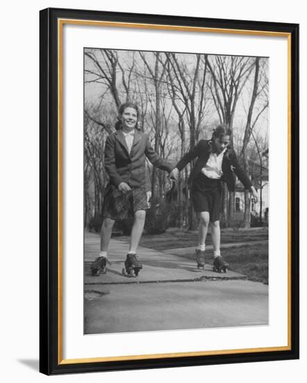 Typical 10 Year Old Girls Known as "Pigtailers" Roller Skating-Frank Scherschel-Framed Photographic Print