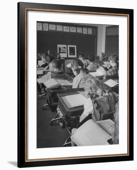 Typical 10 Year Old Girls Known as " Pigtailers" Sitting in Classroom-Frank Scherschel-Framed Photographic Print