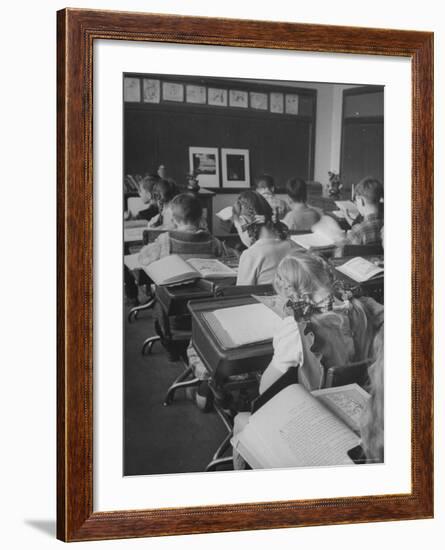 Typical 10 Year Old Girls Known as " Pigtailers" Sitting in Classroom-Frank Scherschel-Framed Photographic Print