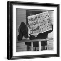 Man Reading the Comics Section of the Detroit Times on a Typical Sunday During WWII-Walter Sanders-Framed Photographic Print