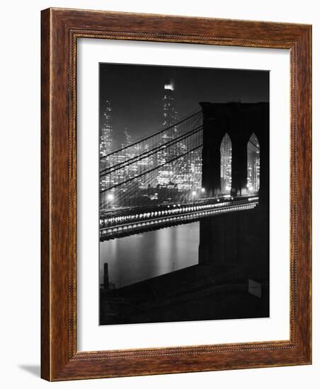 Glittering Night View of the Brooklyn Bridge Spanning the Glassy Waters of the East River-Andreas Feininger-Framed Photographic Print