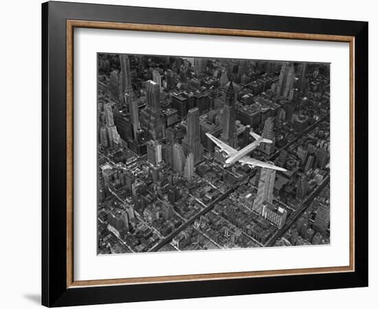 Aerial View of a Dc-4 Passenger Plane in Flight over Manhattan-Margaret Bourke-White-Framed Photographic Print