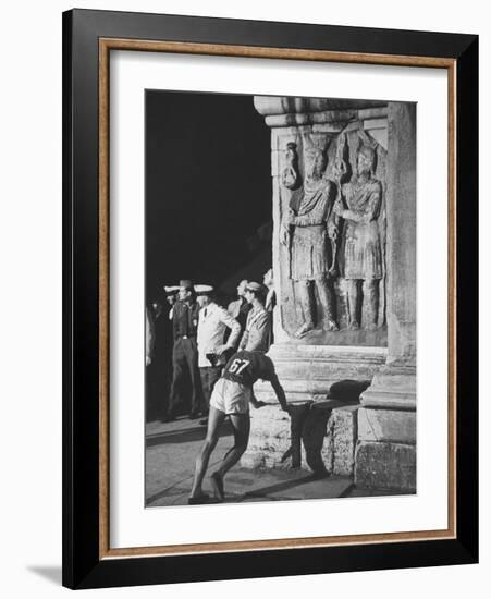 Russian Olympic Runner Rests on Constantines Arch, after Placing 4th in Marathon-null-Framed Photographic Print