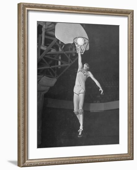 Texas A&M Basketball Player Bob Kurland Reaching to Make a Basket-Myron Davis-Framed Photographic Print