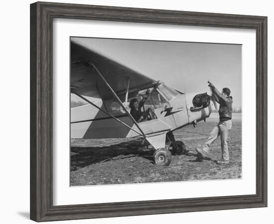 Marie Goerke Sitting in the Plane While the Instructor Kenny Garofalo Stops the Propellor-Bernard Hoffman-Framed Photographic Print