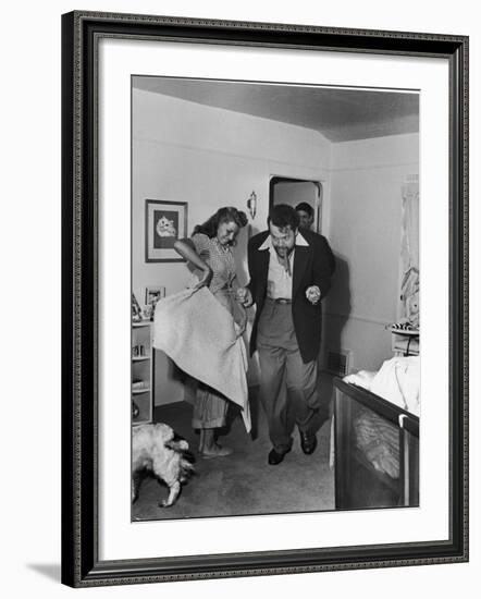 Married Actors Orson Welles and Rita Hayworth Pretending to Bullfight at Home-Peter Stackpole-Framed Premium Photographic Print