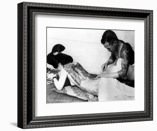 An Unidentified Japanese Tattoo Artist Works on a Woman's Backside-null-Framed Photographic Print