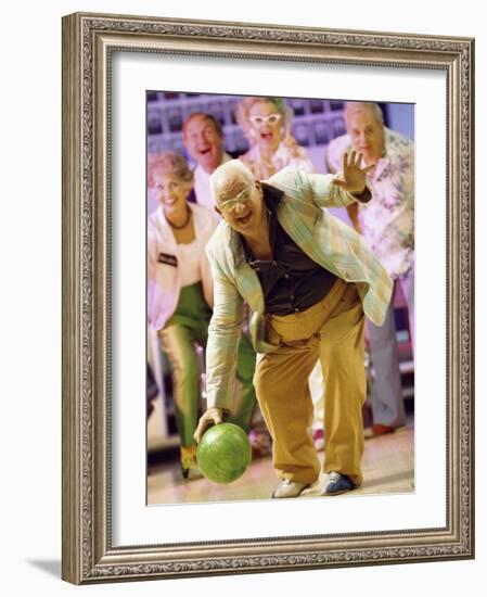 People Watching a Senior Man Bowling at a Bowling Alley-null-Framed Photographic Print