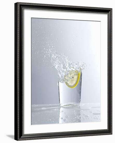 Water Splashing Out of a Glass-Karl Newedel-Framed Photographic Print