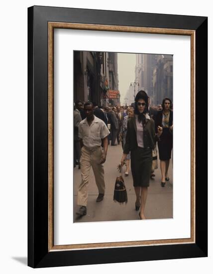 Fashion Model Brigitte Wasserman Walks Along 7th Avenue, New York, New York, 1960-Walter Sanders-Framed Photographic Print