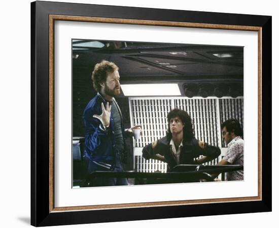 Alien, 1979 directed by Ridley Scott On the set; the director (Ridley Scott) with Sigourney Weaver -null-Framed Photo