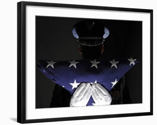 U.S. Airman Stands at Attention After Completing the Flag Dressing Sequence-Stocktrek Images-Framed Photographic Print