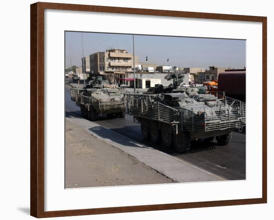 U.S. Army Soldiers Patrolling in Stryker Armored Wheeled Vehicles as Part of Operation Block Party-null-Framed Photographic Print