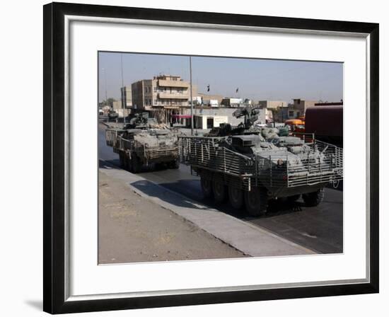 U.S. Army Soldiers Patrolling in Stryker Armored Wheeled Vehicles as Part of Operation Block Party-null-Framed Photographic Print