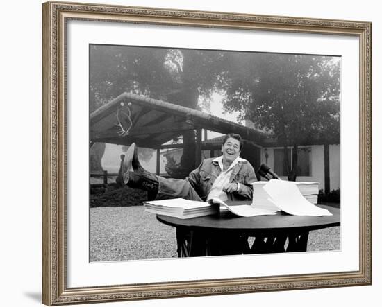 U.S. President Ronald Reagan Shows His Boot Following the Signing of His Tax Bill-null-Framed Photographic Print