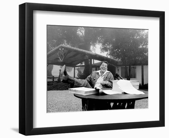 U.S. President Ronald Reagan Shows His Boot Following the Signing of His Tax Bill--Framed Photographic Print