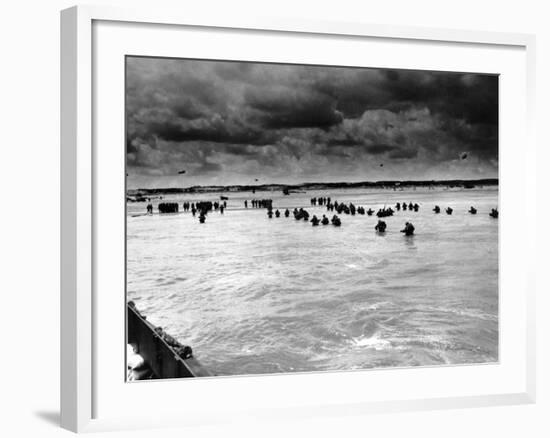 U.S. Reinforcements Wade Through the Surf as They Land at Normandy-null-Framed Photographic Print