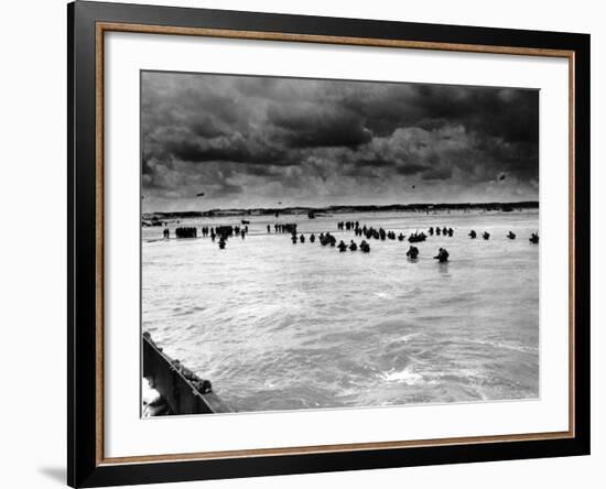 U.S. Reinforcements Wade Through the Surf as They Land at Normandy-null-Framed Photographic Print