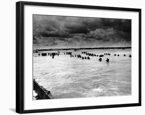 U.S. Reinforcements Wade Through the Surf as They Land at Normandy-null-Framed Photographic Print