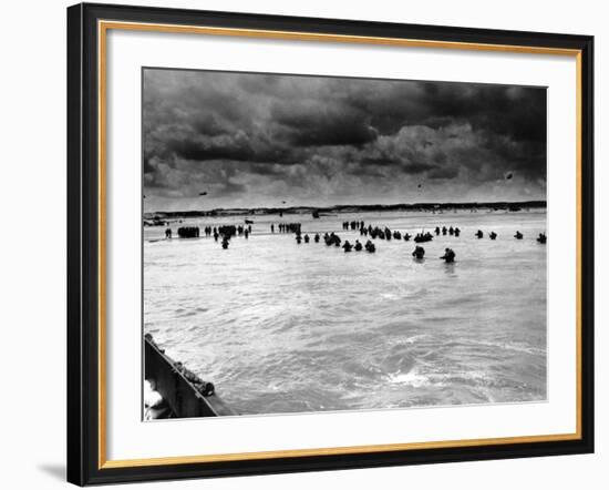 U.S. Reinforcements Wade Through the Surf as They Land at Normandy-null-Framed Photographic Print