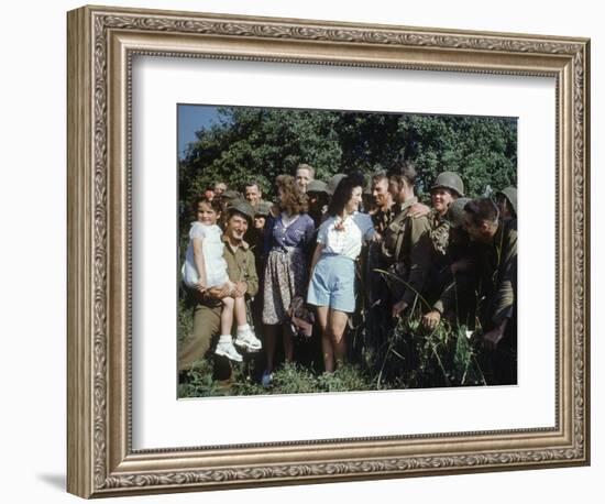 U.S. Soldiers Gather around a French Girl Near Avranches, France, August 1944-Frank Scherschel-Framed Photographic Print