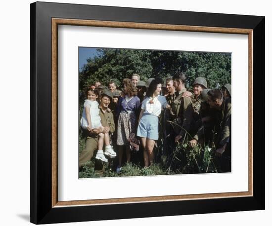 U.S. Soldiers Gather around a French Girl Near Avranches, France, August 1944-Frank Scherschel-Framed Photographic Print