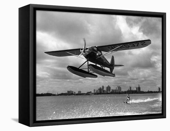 U.S. Water Ski Champion Bruce Parker Being Towed by a Seaplane across Biscayne Bay, 1946-null-Framed Premier Image Canvas