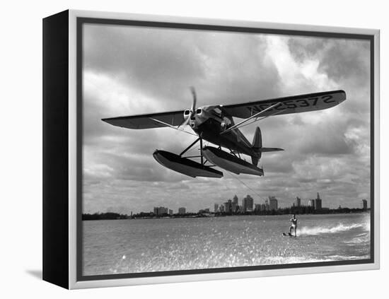 U.S. Water Ski Champion Bruce Parker Being Towed by a Seaplane across Biscayne Bay, 1946-null-Framed Premier Image Canvas