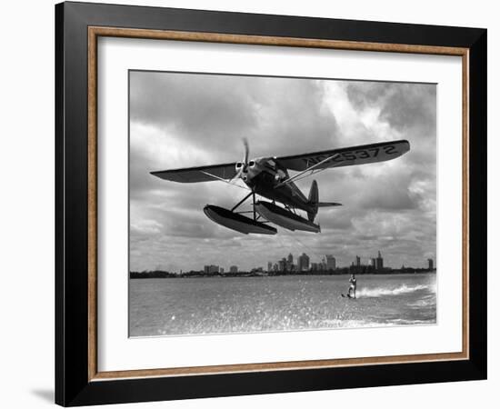 U.S. Water Ski Champion Bruce Parker Being Towed by a Seaplane across Biscayne Bay, 1946-null-Framed Photographic Print