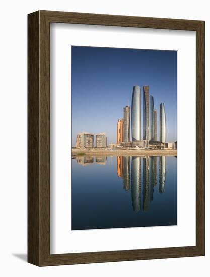 UAE, Abu Dhabi. Downtown waterfront skyscrapers.-Walter Bibikow-Framed Photographic Print