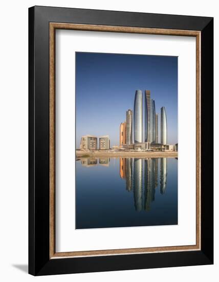 UAE, Abu Dhabi. Downtown waterfront skyscrapers.-Walter Bibikow-Framed Photographic Print