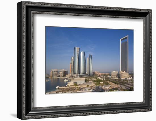 UAE, Abu Dhabi. Downtown waterfront skyscrapers.-Walter Bibikow-Framed Photographic Print