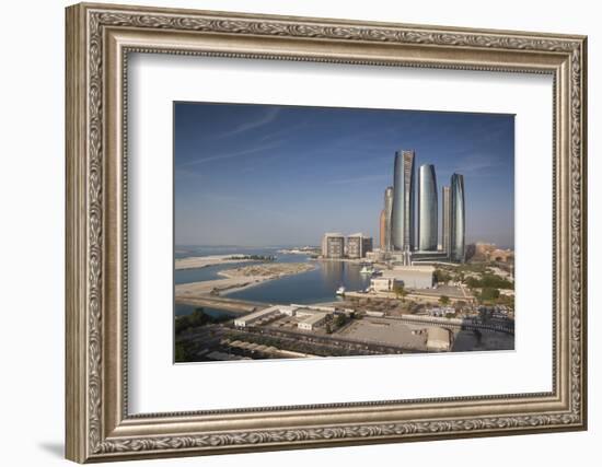 UAE, Abu Dhabi. Downtown waterfront skyscrapers.-Walter Bibikow-Framed Photographic Print