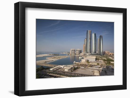 UAE, Abu Dhabi. Downtown waterfront skyscrapers.-Walter Bibikow-Framed Photographic Print