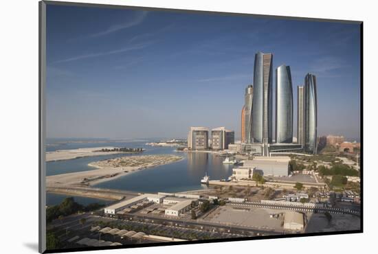 UAE, Abu Dhabi. Downtown waterfront skyscrapers.-Walter Bibikow-Mounted Photographic Print