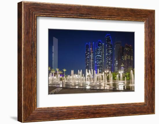 UAE, Abu Dhabi. Fountain in downtown at night.-Walter Bibikow-Framed Photographic Print