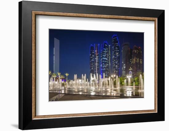 UAE, Abu Dhabi. Fountain in downtown at night.-Walter Bibikow-Framed Photographic Print