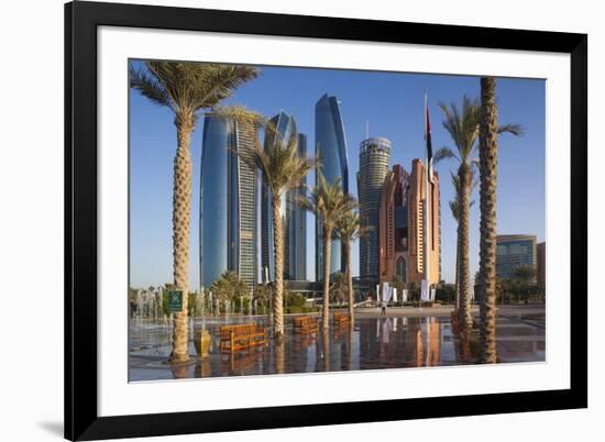 UAE, Abu Dhabi. Palm tree lined fountain in downtown.-Walter Bibikow-Framed Premium Photographic Print