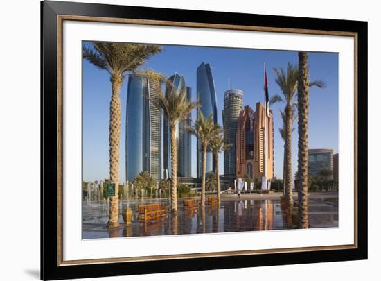 UAE, Abu Dhabi. Palm tree lined fountain in downtown.-Walter Bibikow-Framed Premium Photographic Print