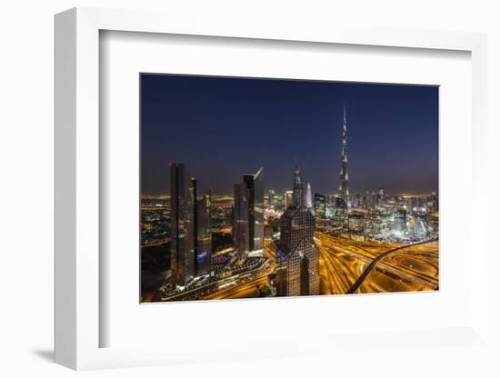UAE, Downtown Dubai. Cityscape with Burj Khalifa at night.-Walter Bibikow-Framed Photographic Print